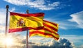 Spanish and Catalan Flags Blowing in the Wind on Blue Sky with Clouds - Generative Ai Royalty Free Stock Photo