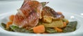 Close-up with Spanish food plate with mixed vegetables and Iberian ham