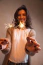 Close-up of sparkler in in woman hands