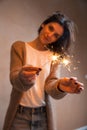 Woman holding sparkler