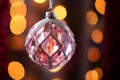 Close-Up of a Sparkling Holiday Ornament Capturing Reflections of Twinkling Lights