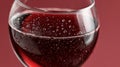 Close-up of sparkling red wine in a glass with bubbles. Royalty Free Stock Photo