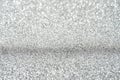 Close up of sparkling silver glitter texture with bright, shimmery surface Royalty Free Stock Photo