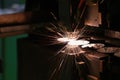 Sparks fly out machine head for metal processing laser metal Royalty Free Stock Photo