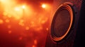 Close-up of a speaker with vibrant orange stage lights. Royalty Free Stock Photo