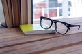 Close-up of spectacles on open book Royalty Free Stock Photo