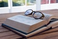 Close-up of spectacles on open book Royalty Free Stock Photo