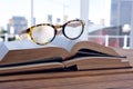 Close-up of spectacles on open book Royalty Free Stock Photo