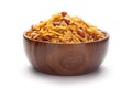Close-Up of Spicy Chatpata Mixture In hand-made handcrafted wooden bowl made with peanuts, corn flakes. Indian spicy snacks