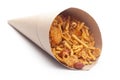 Close-Up of Spicy Chatpata Mixture In handmade handcraft brown paper cone bag made with peanuts, corn flakes. Indian spicy