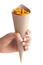 Close-up of Spicy Chutney Sev in brown paper cone holding in hand isolated over white