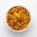 Close up of spicy Ratlami mixture Indian namkeen snacks on a ceramic white bowl.