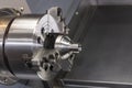 Close up spindle chuck and product part set on high precision Cnc industrial lathe turning machine Royalty Free Stock Photo