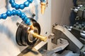 Close up spindle chuck and product part set on high precision Cnc industrial lathe turning machine and during in process Royalty Free Stock Photo