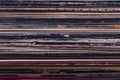 Close-up of the spines of multi-colored covers of old vinyl records, which are stacked. Royalty Free Stock Photo