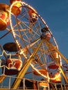 close up of spinning big wheel at fun fair with bright lights. Royalty Free Stock Photo