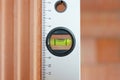 Close up of a spirit level in the plumb line