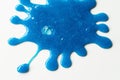 Close up Splash out of Blue Slime Stretching and Mucilage on White Table Royalty Free Stock Photo