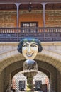 Statue with greedy smile looking at a fresh water fountain