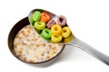 Close up of a spoon above a bowl with cereals and milk, Royalty Free Stock Photo