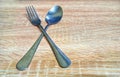 Close-up spoon and fork with wooden table Royalty Free Stock Photo