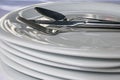 Spoon, knive, fork on plates in restaurant