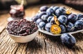 Close-up spoon from plum jam and fresh plums in the background Royalty Free Stock Photo