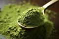 close-up of a spoonful of green superfood powder