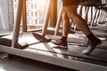 Close up of sport man running on treadmill in fitness gym at condominium in urban. People lifestyles and sport activity concept