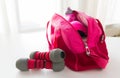 Close up of sports stuff in bag and dumbbells Royalty Free Stock Photo
