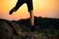 Close-up of Sportsman's Legs Running on the Rocky Mountain Trail at Night. Active Lifestyle