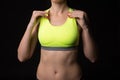 A close up of a sporty woman with a muscullar stomach wearing sp Royalty Free Stock Photo