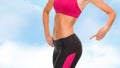 Close up of sporty woman pointing at her buttocks Royalty Free Stock Photo