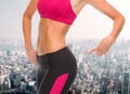 Close up of sporty woman pointing at her buttocks Royalty Free Stock Photo