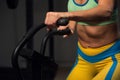 Close-up - Sporty woman working out in air bike Royalty Free Stock Photo