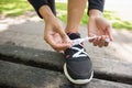 Close up of a sporty young woman wearing shoes in park Royalty Free Stock Photo