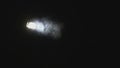 Close-up of spotlight with smoke in dark. Media. Stage dramatic smoke and spotlight light in dark. Light of searchlight Royalty Free Stock Photo