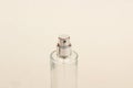 Close up of a spray perfume bottle made of glass and isolated on a white background. Royalty Free Stock Photo