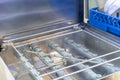 Close up spraying nozzle and detail inside of automatic dishwasher machine for industrial