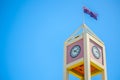 Close-up Square Clock tower at the Rocks, shopping mall with Australia Flag Sydney, Australia. Royalty Free Stock Photo