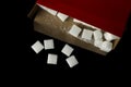Close-up. Square shape white sugar cube with a red box. Royalty Free Stock Photo