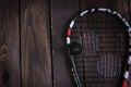 Close up of a squash racket and ball on the wooden background Royalty Free Stock Photo