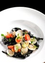 Close-up of squid ink colored tagliatelle