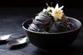 close-up of squid ink ice cream on a black ceramic bowl Royalty Free Stock Photo