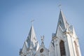 Close-up of St. Anna Roman Catholic Church facade shining in sun dawn rays, bright sun sidelight