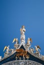 Close up of St Mark`s Apostle, angels and golden lion on the top of Basilica di San Marco, St Mark`s Basilica in Venice Royalty Free Stock Photo