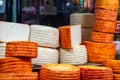 Close Up Stack of Artisan Cheese Wheels at the Market Royalty Free Stock Photo