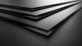 A close up of a stack of black metal sheets on top of each other, AI