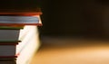 Close-up of a stack of books. The concept of home reading of paper books, school education and Institute, back to school. Royalty Free Stock Photo