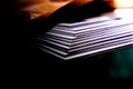 Close-up of a stack of books on a table in the dark Royalty Free Stock Photo